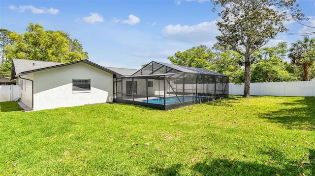 back of property featuring a fenced in pool, a fenced backyard, stucco siding, and a yard