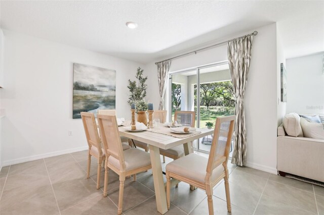 5334 SW 52nd Ct, Gainesville, FL 32608 - dining space featuring light tile patterned floors and baseboards