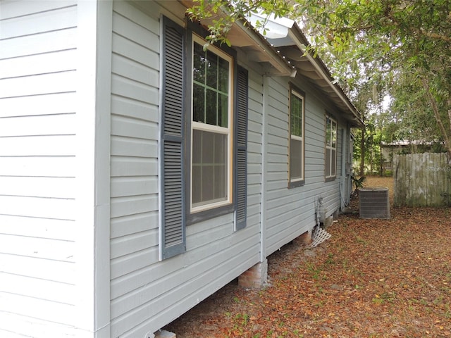 219 SE 3rd Ave, Williston, FL 32696 - view of property exterior featuring fence and cooling unit