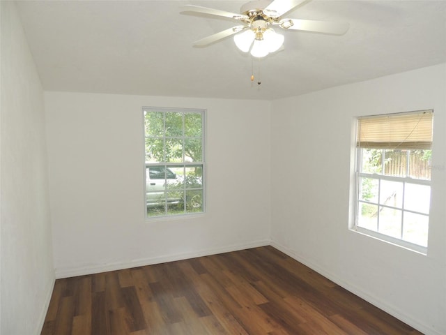 219 SE 3rd Ave, Williston, FL 32696 - unfurnished room with dark wood-style flooring, ceiling fan, and baseboards