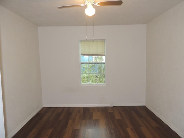 219 SE 3rd Ave, Williston, FL 32696 - empty room featuring dark wood finished floors, baseboards, and ceiling fan