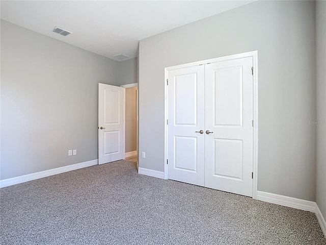 2423 Sadnet Ln, North Port, FL 34286 - unfurnished bedroom featuring carpet flooring, a closet, visible vents, and baseboards