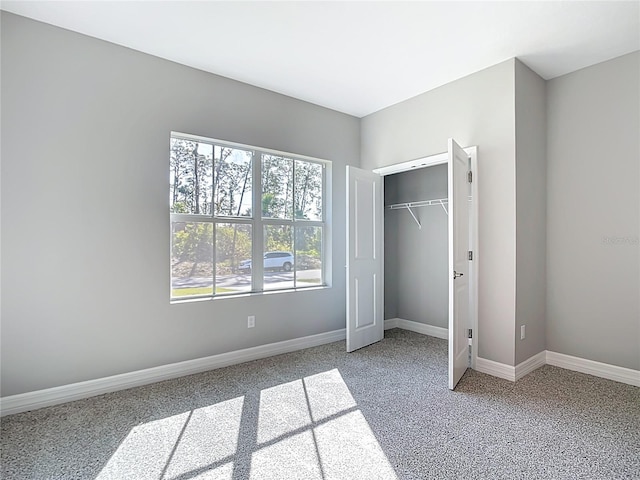 2423 Sadnet Ln, North Port, FL 34286 - unfurnished bedroom with carpet, a closet, and baseboards