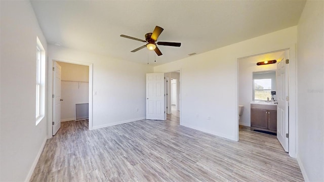 1610 SW 152nd Ct, Ocala, FL 34481 - unfurnished bedroom featuring baseboards, visible vents, a walk in closet, and light wood finished floors