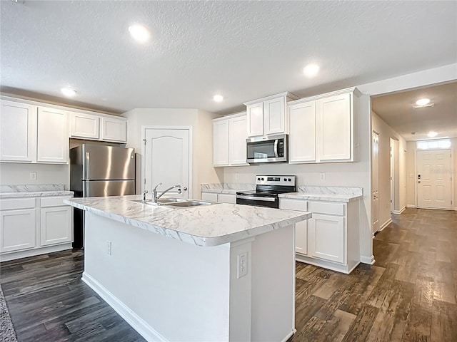 19 Roxland Ln, Palm Coast, FL 32164 - kitchen featuring dark wood-type flooring, a sink, appliances with stainless steel finishes, and light countertops