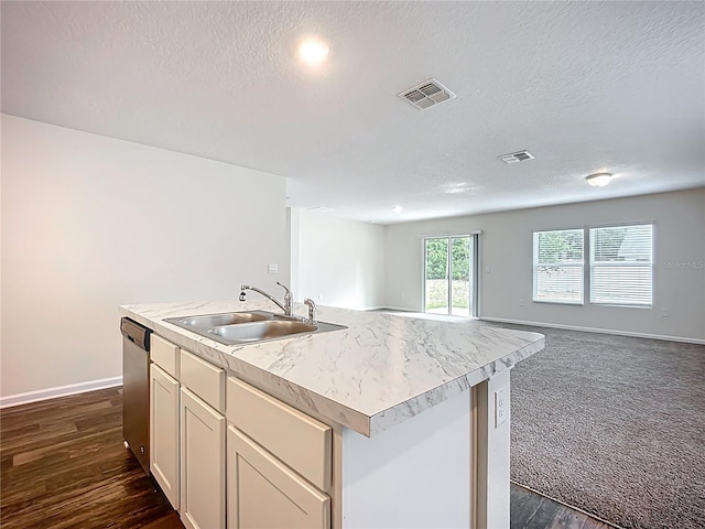 19 Roxland Ln, Palm Coast, FL 32164 - kitchen featuring visible vents, stainless steel dishwasher, open floor plan, light countertops, and a sink