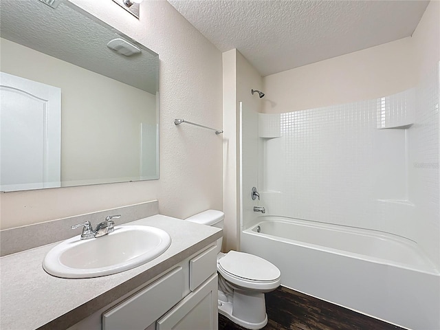 19 Roxland Ln, Palm Coast, FL 32164 - full bathroom featuring shower / bath combination, a textured ceiling, wood finished floors, vanity, and toilet