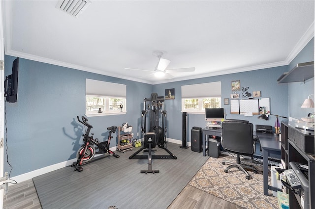 office with plenty of natural light, wood finished floors, and visible vents