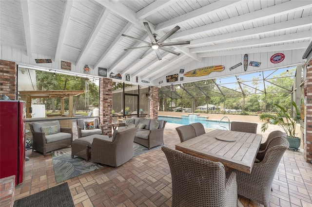 sunroom / solarium with an outdoor hangout area, a ceiling fan, and beam ceiling