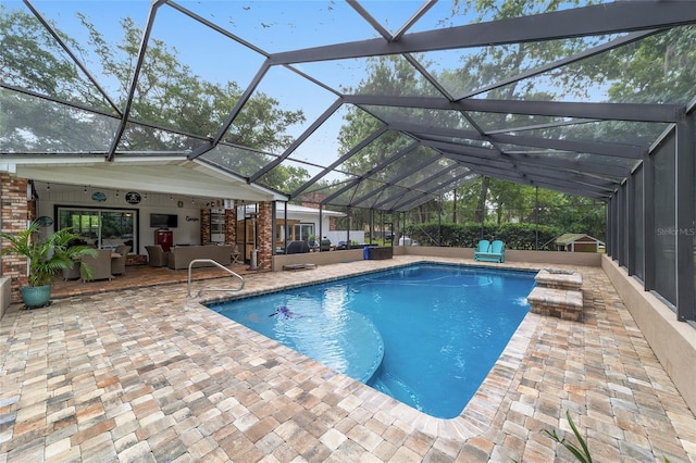 pool with a patio, glass enclosure, and outdoor lounge area