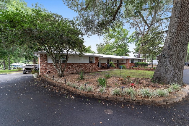 single story home with brick siding