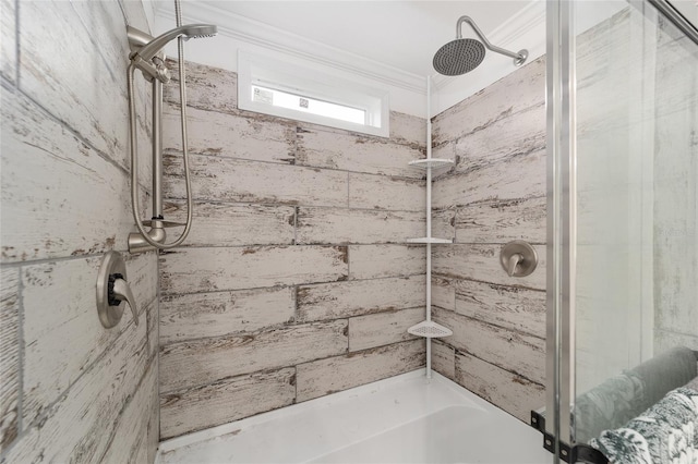 bathroom featuring crown molding and tiled shower
