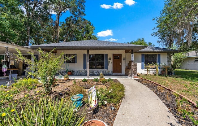 408 Etheredge St, Bushnell, FL 33513 - single story home with stucco siding, covered porch, and stone siding