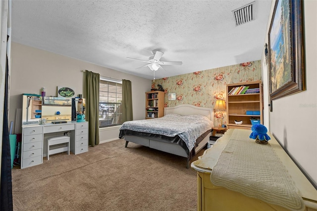 408 Etheredge St, Bushnell, FL 33513 - bedroom with wallpapered walls, carpet flooring, ceiling fan, and a textured ceiling
