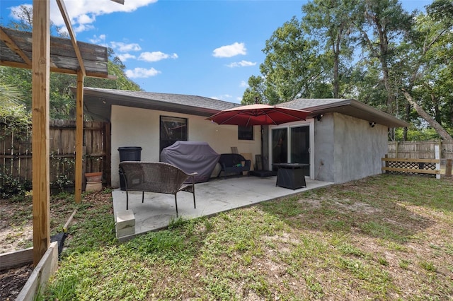 408 Etheredge St, Bushnell, FL 33513 - back of property featuring stucco siding, a patio, and a shingled roof