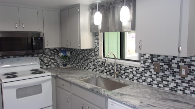9880 SW 101st Pl, Ocala, FL 34481 - kitchen featuring a sink, electric range, backsplash, and decorative light fixtures