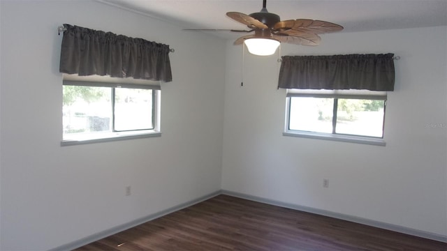 9880 SW 101st Pl, Ocala, FL 34481 - empty room featuring baseboards, dark wood finished floors, and ceiling fan
