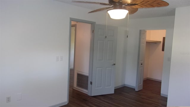 9880 SW 101st Pl, Ocala, FL 34481 - unfurnished bedroom with a walk in closet, visible vents, wood finished floors, baseboards, and a closet