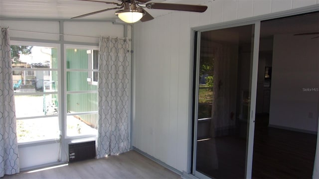 9880 SW 101st Pl, Ocala, FL 34481 - doorway with ceiling fan and light wood-style flooring