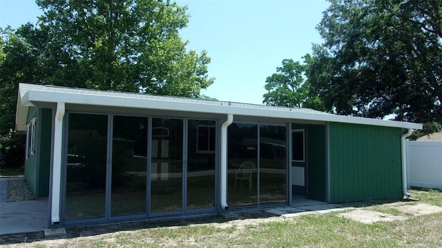 9880 SW 101st Pl, Ocala, FL 34481 - rear view of property featuring a sunroom