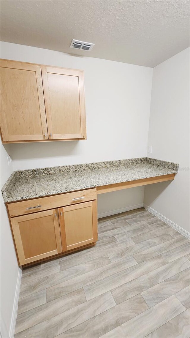 15407 SW 59th Avenue Rd, Ocala, FL 34473 - interior details with baseboards, visible vents, wood finished floors, and built in study area