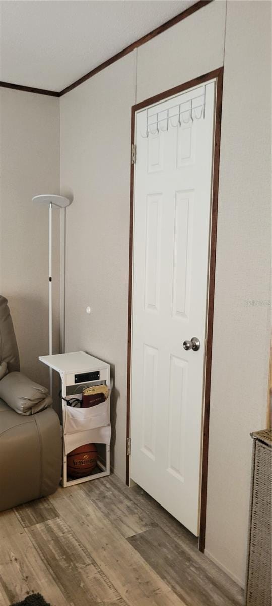 15951 NW 44th Avenue Rd, Reddick, FL 32686 - living area featuring wood finished floors and ornamental molding