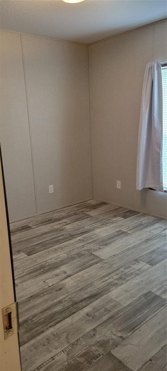 15951 NW 44th Avenue Rd, Reddick, FL 32686 - unfurnished room featuring wood finished floors