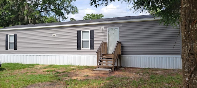 15951 NW 44th Avenue Rd, Reddick, FL 32686 - rear view of property featuring entry steps