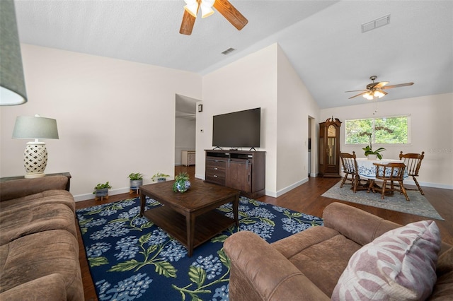 living room featuring a ceiling fan, baseboards, wood finished floors, and high vaulted ceiling