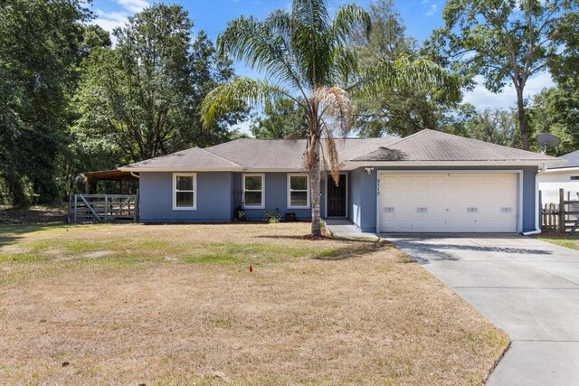 single story home featuring fence, a garage, stucco siding, a front yard, and driveway