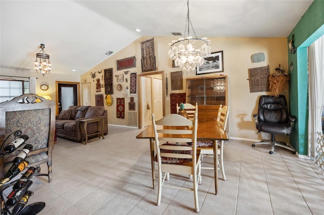 dining room featuring a chandelier, lofted ceiling, light tile patterned floors, and baseboards
