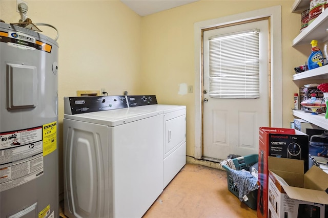 laundry room with water heater and washing machine and dryer
