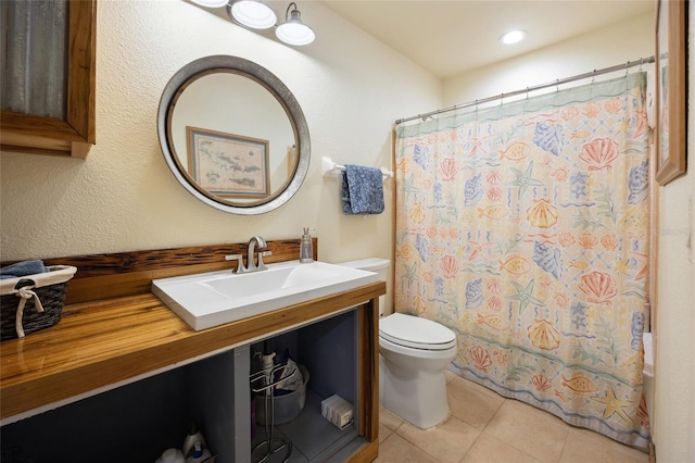 bathroom with toilet, tile patterned flooring, vanity, and a shower with shower curtain