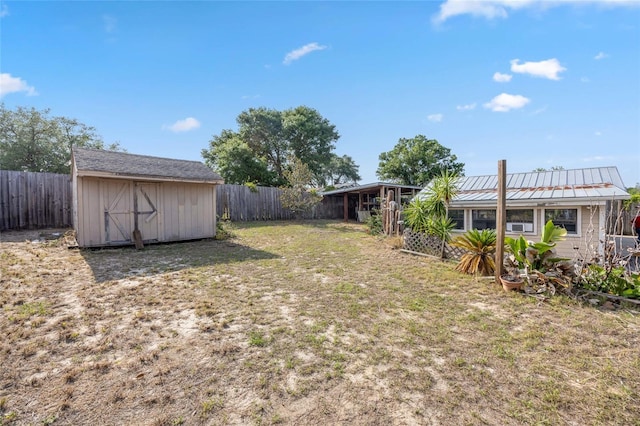 view of yard featuring an outbuilding and a storage shed
