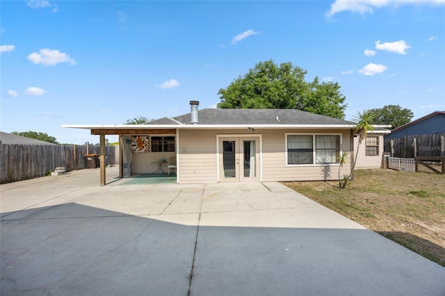 view of front of home featuring french doors and fence