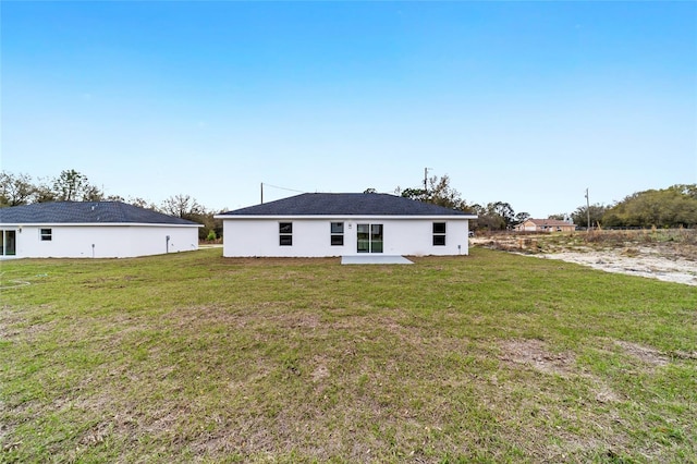 13505 SW 112th Pl, Dunnellon, FL 34432 - rear view of property featuring a yard and a patio area