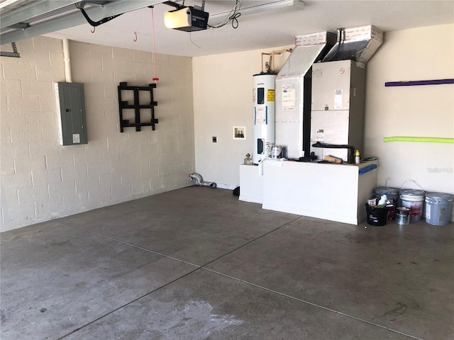 garage with heating unit, a garage door opener, electric panel, water heater, and concrete block wall