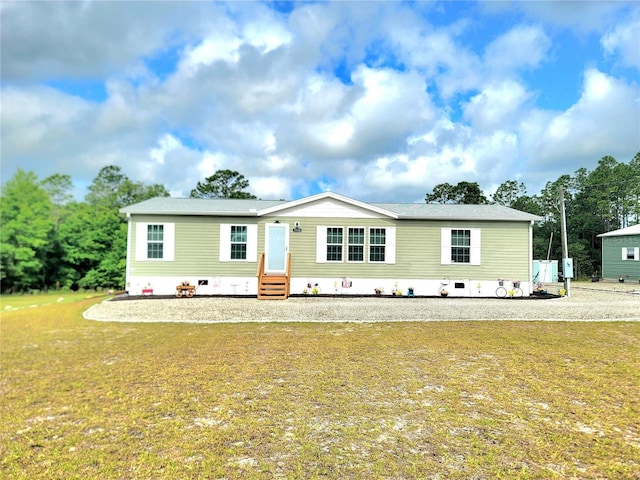 7030 SE 120th Ct, Morriston, FL 32668 - manufactured / mobile home featuring a front yard and entry steps