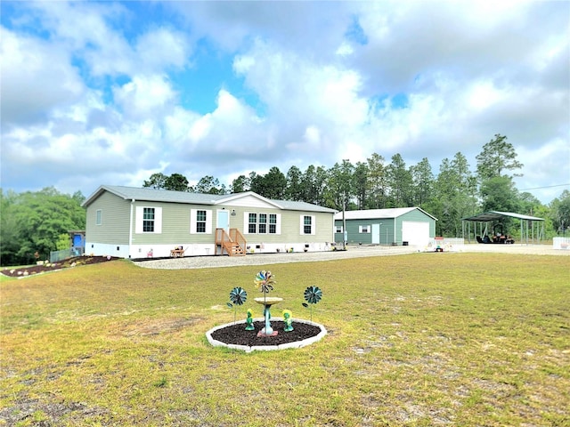 7030 SE 120th Ct, Morriston, FL 32668 - manufactured / mobile home with a garage, crawl space, a front yard, an outbuilding, and a carport