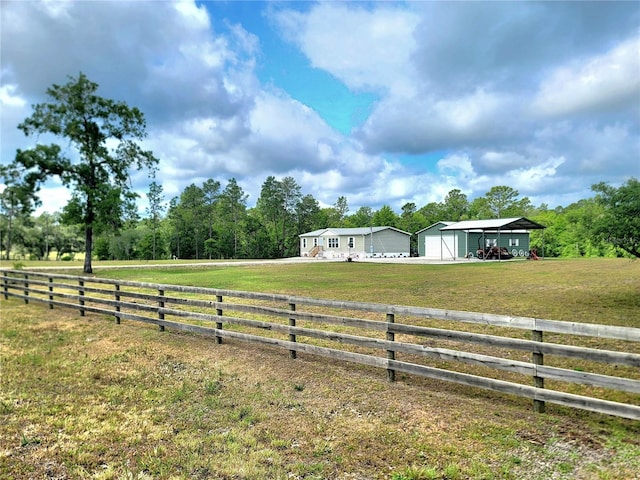 7030 SE 120th Ct, Morriston, FL 32668 - view of yard with fence, driveway, and a garage