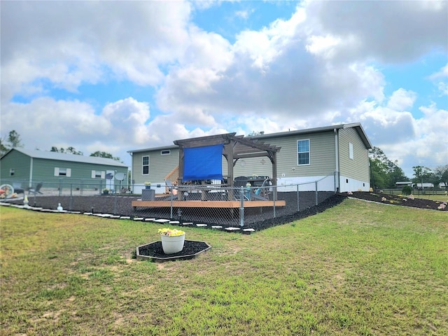 7030 SE 120th Ct, Morriston, FL 32668 - back of house featuring a lawn, a pergola, and a fenced backyard
