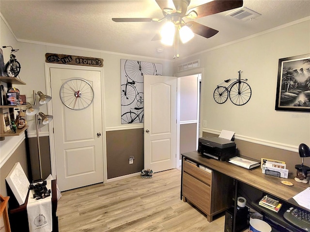 7030 SE 120th Ct, Morriston, FL 32668 - office featuring visible vents, light wood finished floors, ceiling fan, and baseboards