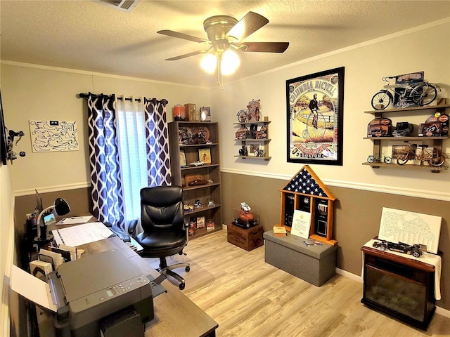 7030 SE 120th Ct, Morriston, FL 32668 - home office with ornamental molding, a textured ceiling, ceiling fan, and wood finished floors