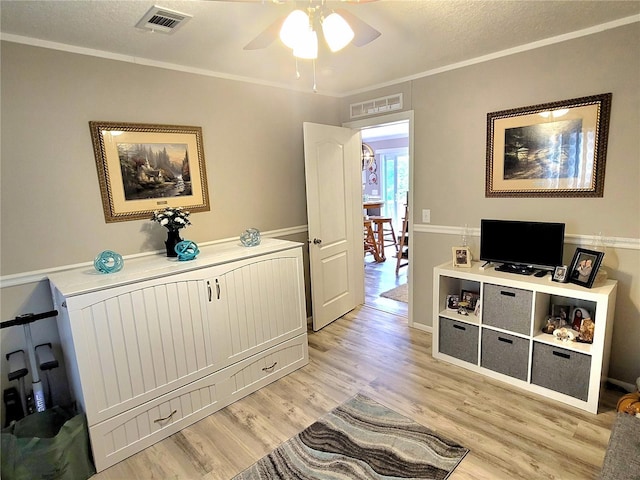 7030 SE 120th Ct, Morriston, FL 32668 - interior space with a textured ceiling, visible vents, ornamental molding, and light wood-type flooring