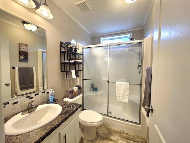 7030 SE 120th Ct, Morriston, FL 32668 - bathroom with visible vents, a stall shower, wood finished floors, vanity, and ornamental molding