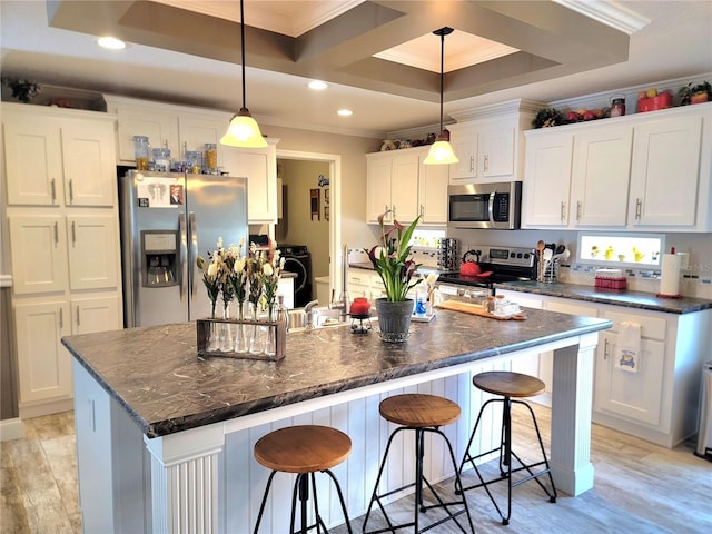 7030 SE 120th Ct, Morriston, FL 32668 - kitchen with crown molding, appliances with stainless steel finishes, recessed lighting, and white cabinetry