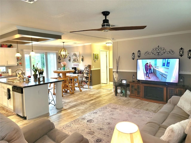 7030 SE 120th Ct, Morriston, FL 32668 - living area with ornamental molding, ceiling fan with notable chandelier, light wood-type flooring, and a textured ceiling