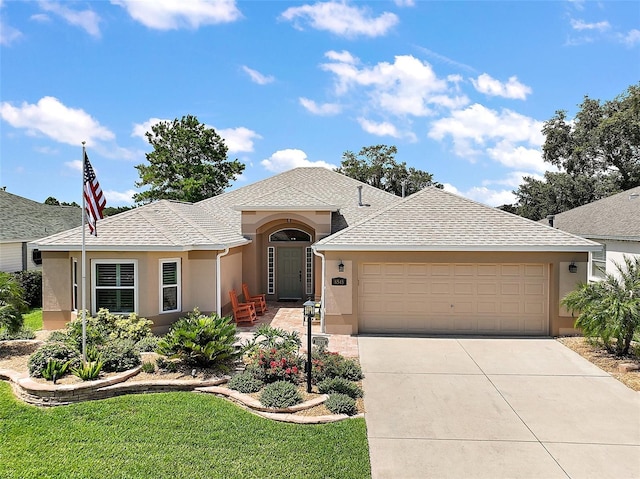 8545 SE 168th Kittredge Loop, The Villages, FL 32162 - single story home featuring stucco siding, driveway, an attached garage, roof with shingles, and a front yard