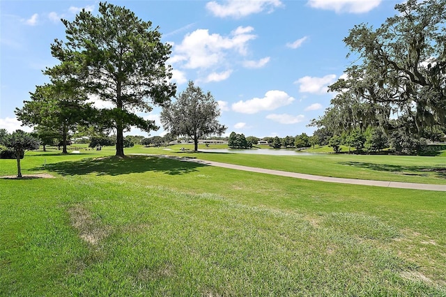 8545 SE 168th Kittredge Loop, The Villages, FL 32162 - view of community with a water view, a lawn, and golf course view
