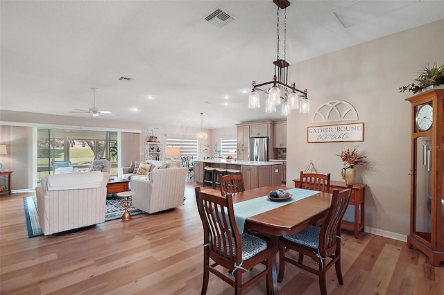 8545 SE 168th Kittredge Loop, The Villages, FL 32162 - dining area featuring light wood-style floors, ceiling fan, and recessed lighting